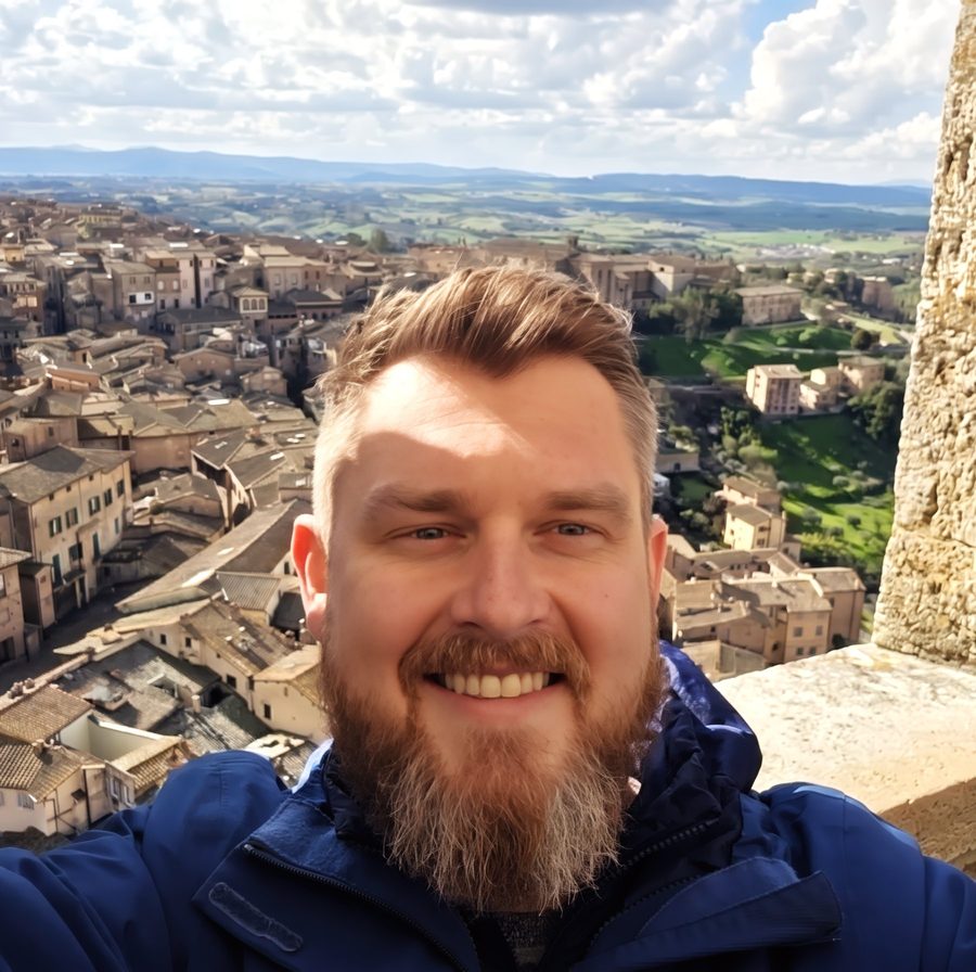 Alex, Tour Director, above a Tuscan hill town